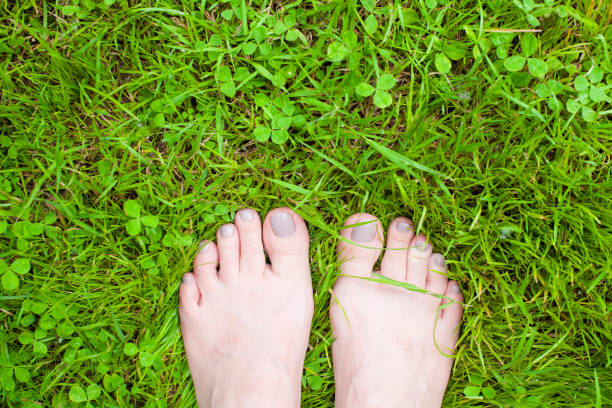 istock Young woman standing in grass 1169715028