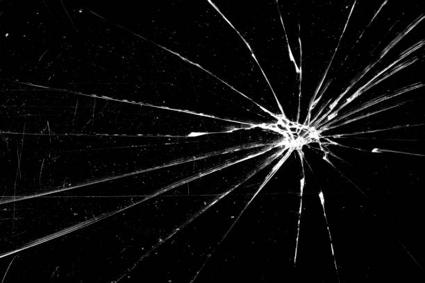 istock cracked glass isolated on a black background. broken glass 1169716336
