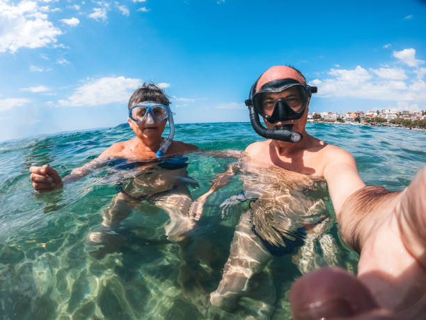 istock Senior couple with snorkeling masks 1169716351