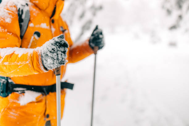 Man exploring mountain, hiking with backpack on his back