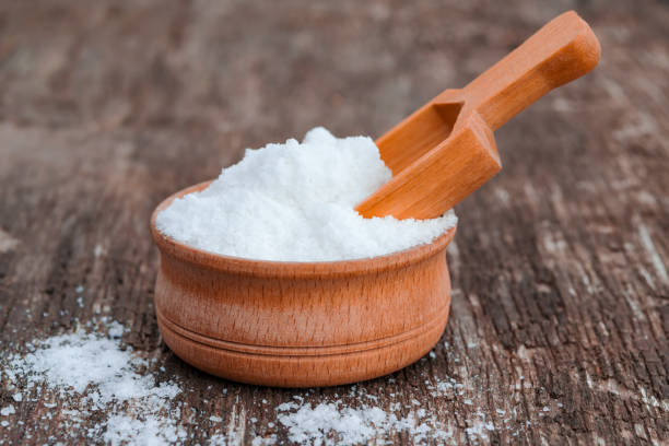 istock Slide salt on an old wooden table with a wooden spoon, 1169716516