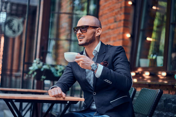istock Happy smiling man is drinking coffee 1169717322
