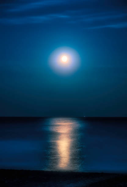 istock Moonlit night over the sea. Full moon and lunar path 1169717742