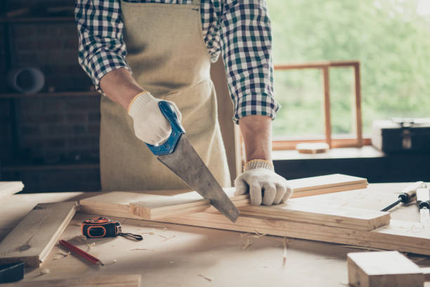istock Cropped close-up view of his he nice skilled guy expert using instrument cutter creating new furniture order house home box frame at industrial brick loft style interior workplace indoors 1169718688