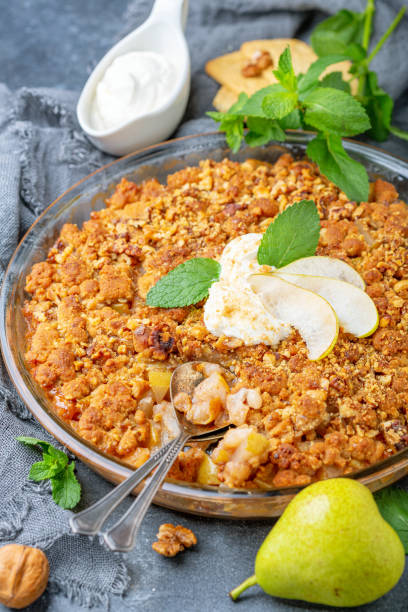 istock Summer pear pie with crumbs and walnuts. 1169718838
