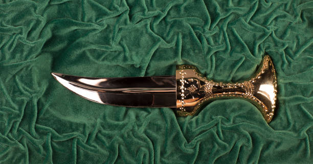 istock golden arabic dagger on a green background 1169719814