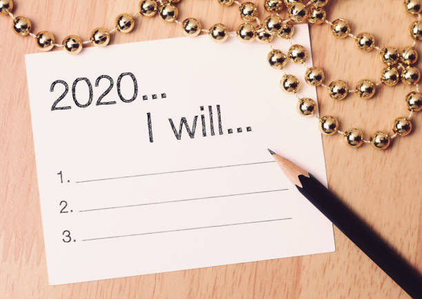 istock 2020 goals list with gold decoration. 1169719830