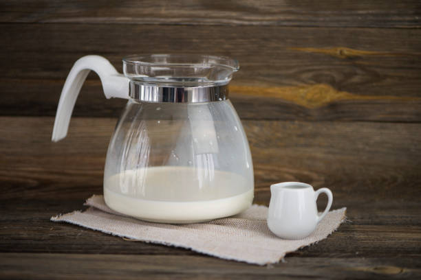 istock large glass jug with milk and a small ceramic jug 1169720648