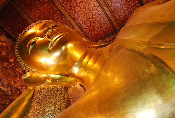 istock Gold reclining Buddha statue at Wat Pho, Bangkok, Thailand. 1169720732