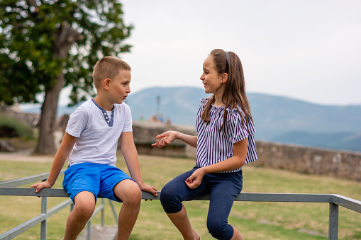 Brother and sister spending time outdoors.