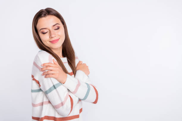 istock Profile photo of overjoyed lady hands touching nice striped pullover isolated white background 1169724774