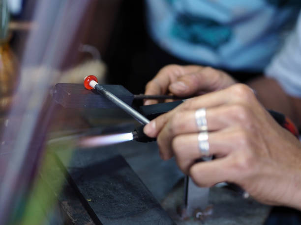istock Process of glass bead at work. Glass Artist in his workshop 1169725001