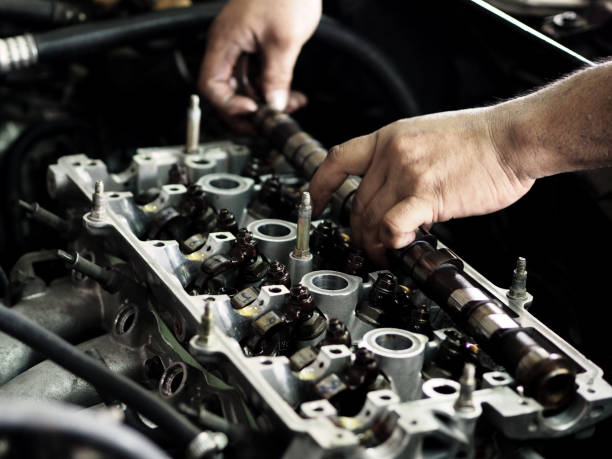 istock Hands of a worker repairing. Mechanic fixing car engine inside 1169725963