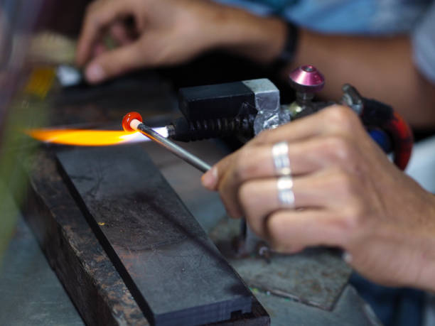 istock Process of glass bead at work. Glass Artist in his workshop 1169726295