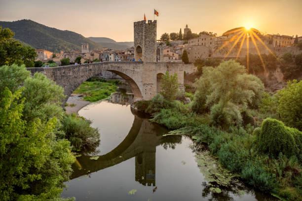 medieval bridge with antique gate in besalu at sunset, catalonia, spain - spain gerona architecture building exterior imagens e fotografias de stock