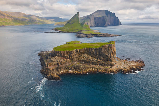 istock Faroe islands dramatic coastline viewed from helicopter. Vagar flight 1169730414