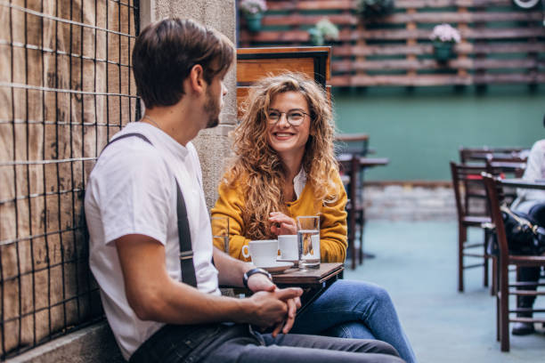 istock Young couple sitting in cafe 1169730849