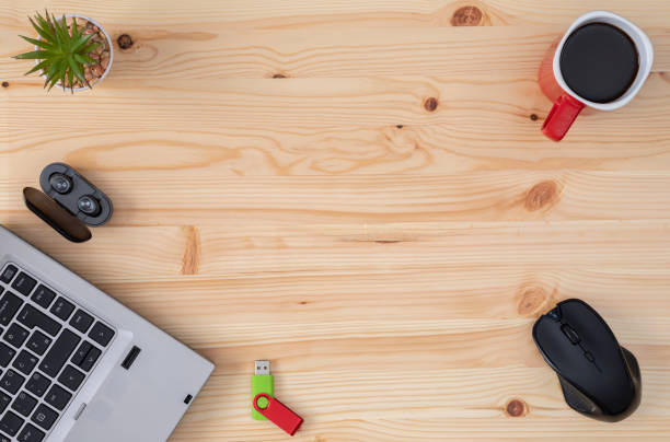 istock Office desk table with laptop computer and cup of coffee 1169733049