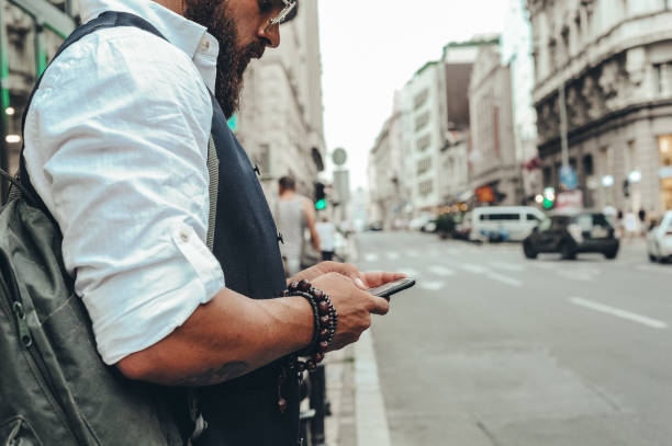 istock Urban young businessman waiting for a Uber ride 1169733297