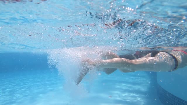 Woman's doing water aerobics in a pool