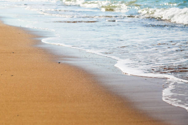 istock Sea waves wash sand. 1169734973