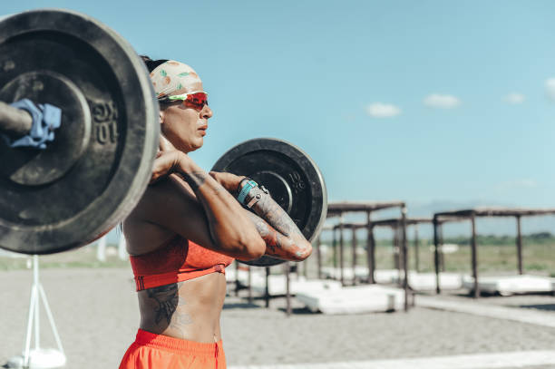 istock Strong and confident female athlete working out on the beach 1169735961