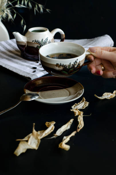 istock woman hand holding teacup 1169736018