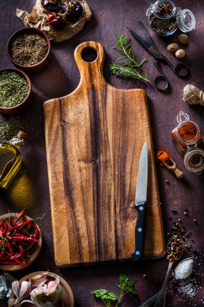 istock Empty cutting board and spices and ingredients shot from above. Copy space. 1169736104