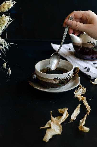 istock woman hand holding teaspoon 1169736235