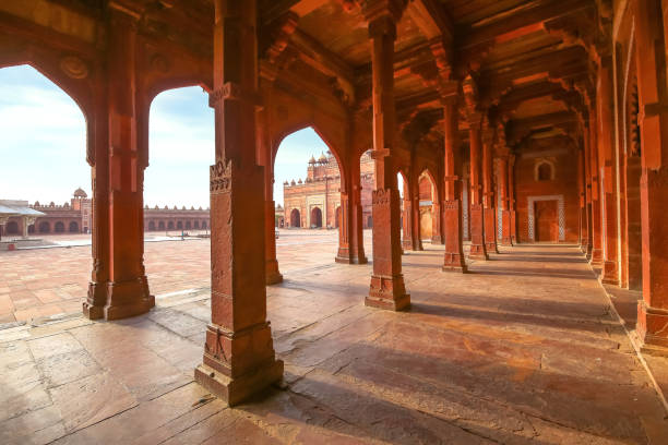 istock Fatehpur Sikri red sandstone architecture structure with view of columns and largest Indian mughal architecture gateway known as the 