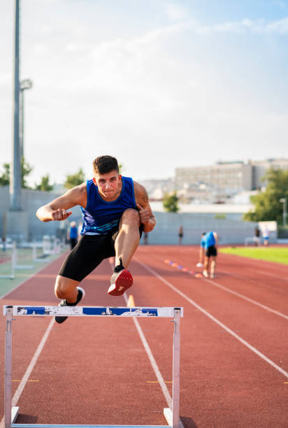 istock Athlete Man Preparing And Runs Hurdles for Track and Field 1169738798