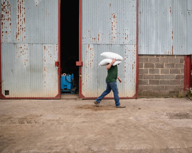 Farmer Carrying Farming Bags
