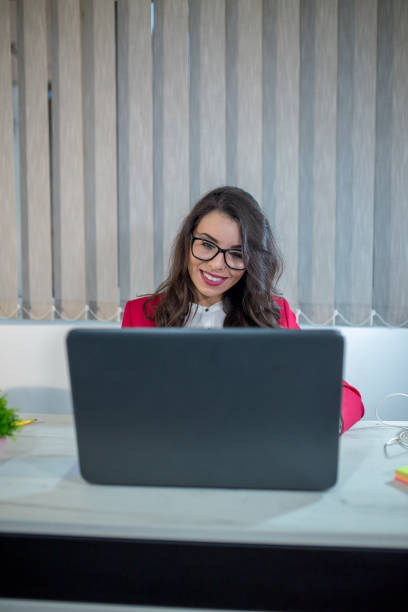 istock Beautiful girl in the office 1169740240