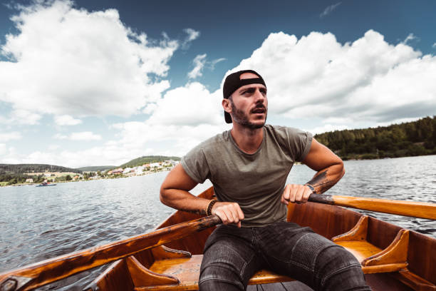 istock man rowing in the lake 1169740364