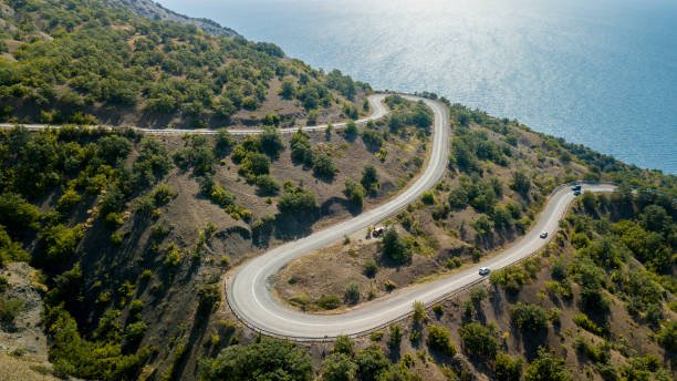 istock Crimea trip: view from drone of curvy mountain road 1169741479