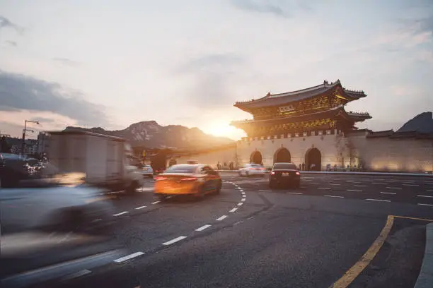 Traffic in front of Gyeongbok palace gate in Seoul City, South Korea