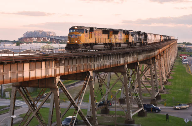 Huey P. Long Bridge Eastbound Union Pacific Railway freight train on the Huey P. Long Bridge across the Mississippi River. Train in descending the four mile long viaduct on the eastbound side.
May 10, 2017. robertmichaud stock pictures, royalty-free photos & images