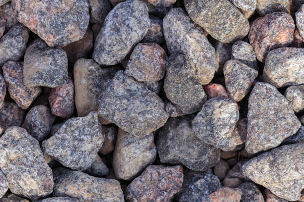 La toile de fond de grandes pierres de granit à proximité. La texture du gravier. - Photo