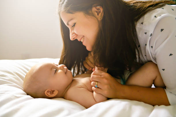 istock A Mother and baby on bed having fun 1169746049