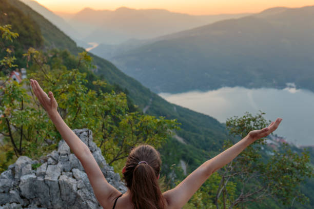 istock Female traveler enjoying beautiful mountain view 1169746218