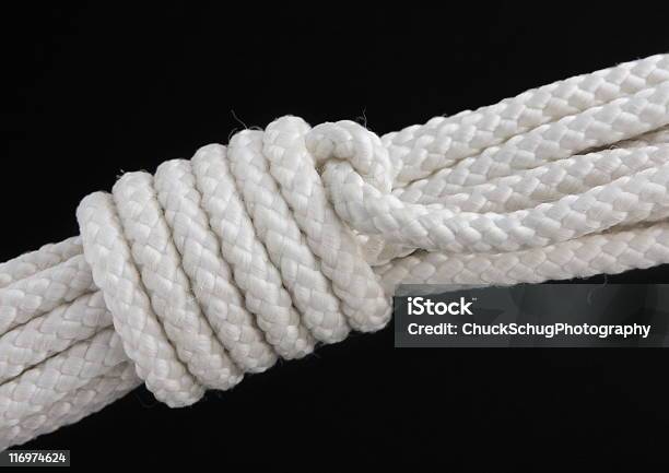 Mountain Coil Rope Knot Stock Photo - Download Image Now - Black Background, Rope, Attached