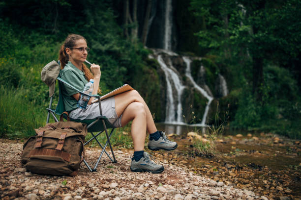 istock Woman biologist taking notes in nature 1169747992