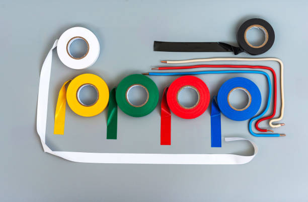 istock Rubber insulating tape of different colors and samples of single-core wires on a gray background 1169748267