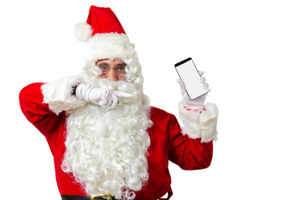 istock Santa Claus  showing smart phone on white blackground with copy space for text 1169750064