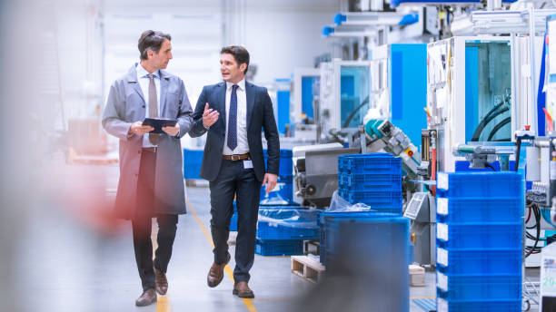 istock Engineer giving manager a guided tour through a factory 1169752613