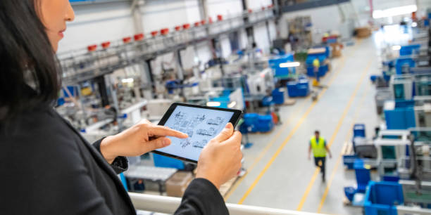 istock Woman using a digital tablet in a factory 1169752664