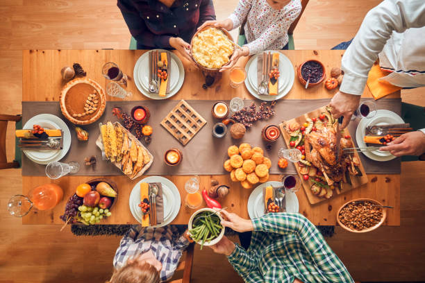 istock Family Having Traditional Holiday Stuffed Turkey Dinner 1169753077