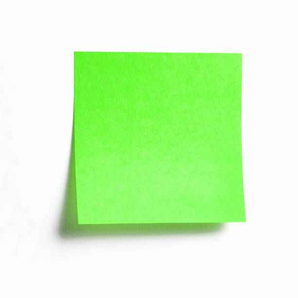 note collante verte vibrante avec l'ombre d'isolement sur le blanc - planning adhesive note business office photos et images de collection