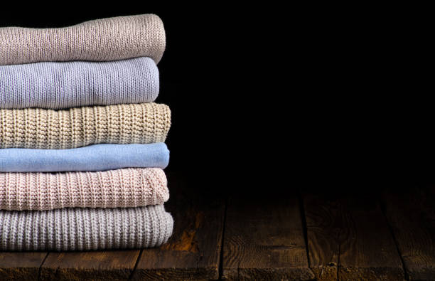 istock stack of clothes from knitted knitwear 1169757179