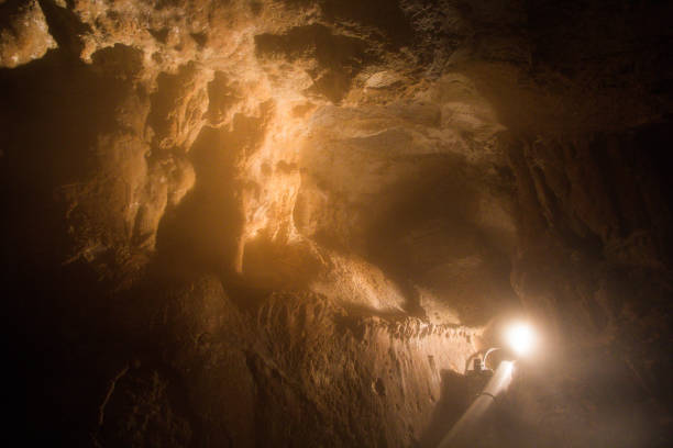 istock Stalactites and stalagmites illuminated by lights in a cave 1169759880